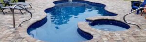 Narellan Pools Monument Fiberglass Swimming Pool with brick paving surrounds