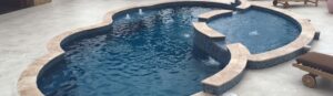 Narellan Pools Resolute Fiberglass Swimming Pool and Resolute Tanning Ledge with bubbling spa jets 1