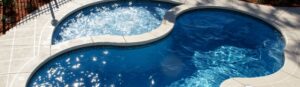 Narellan Pools Resolute Fiberglass Swimming Pool and Resolute Tanning Ledge with bubbling spa jets 2