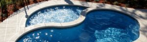 Narellan Pools Resolute Fiberglass Swimming Pool and Resolute Tanning Ledge with bubbling spa jets 2