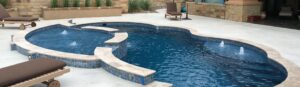 Narellan Pools Resolute Fiberglass Swimming Pool and Resolute Tanning Ledge with waterline tiles